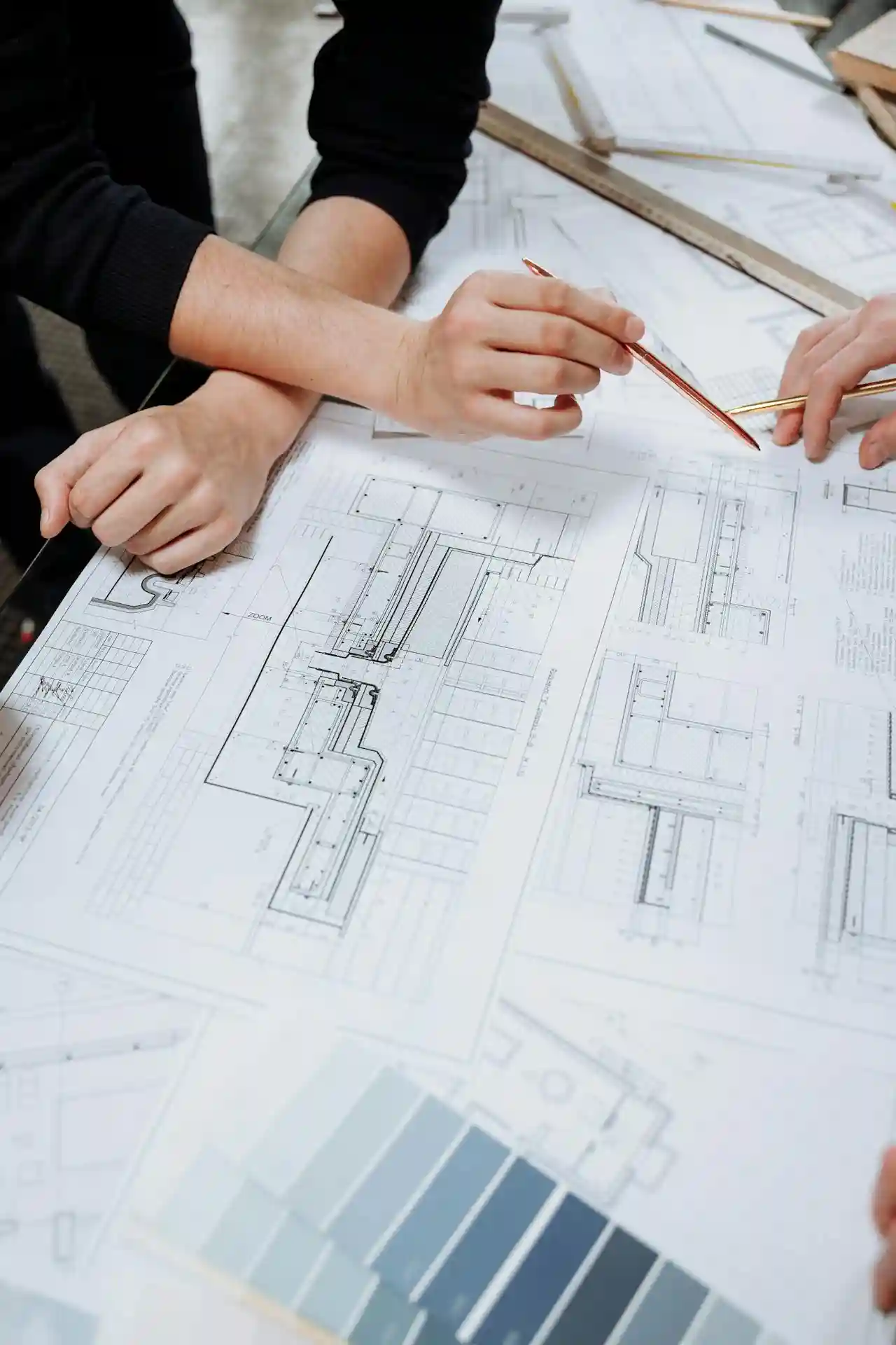 people working with Construction plans